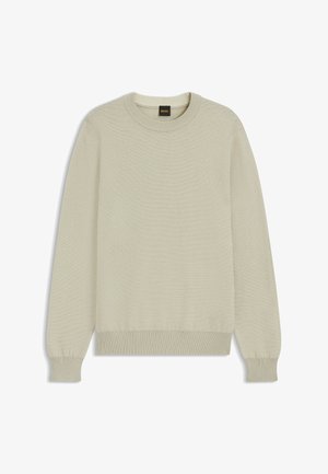 Maglione a maglia beige chiaro con scollatura a girocollo, polsini e orlo a coste. Il tessuto ha un aspetto tessuto e strutturato. Etichetta del marchio visibile.