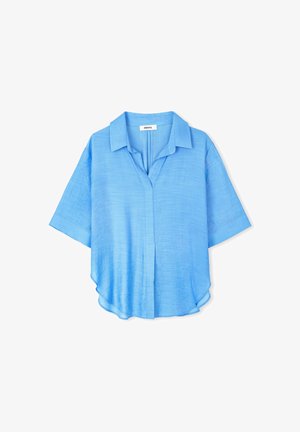 Light blue linen shirt with short sleeves, a notched collar, and a curved hem. Features a button-up front and soft, textured fabric.