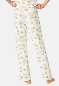 Vita pyjamasbyxor med en färgglad tryck av cocktails, limeklyftor, kaktusar och blommor. Tillverkade av mjukt, lätt material med en avslappnad passform.