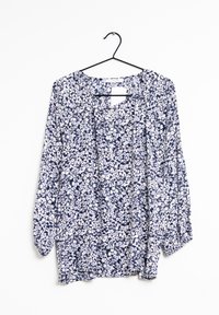 Blusa floreale a maniche lunghe con uno sfondo blu navy e motivi di fiori bianchi e rossi, tessuto leggero e vestibilità ampia.