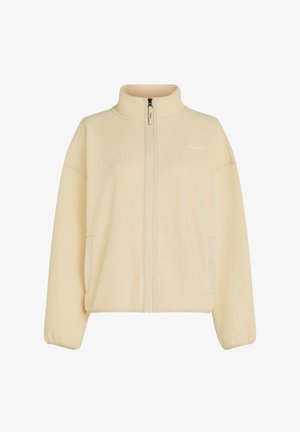 Pehmeast kreemjas värvi fliisjakist, millel on kõrge krae, täispikk eesmine lukustus ja küljetaskud. Tekstuuriga kangas koos ribikätistega.