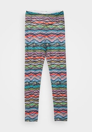 Tights with a multicolored zigzag pattern in blue, green, purple, and orange. Made of stretchable fabric with a smooth texture.