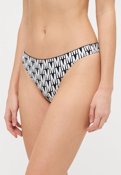 Black and white bikini bottom featuring an M pattern, made from a smooth fabric with minimal coverage and a thin waistband.
