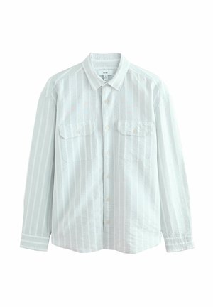 Chemise boutonnée bleu clair avec des rayures blanches verticales, deux poches poitrine et une coupe décontractée. Fabriquée dans un tissu texturé.