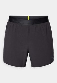 Black athletic shorts with a smooth texture, an elastic waistband featuring a yellow accent, and a small logo on the lower right side.