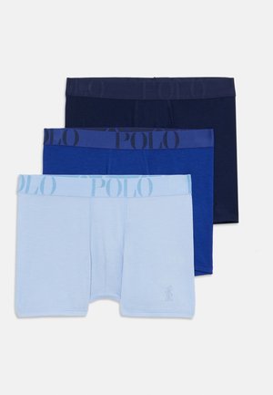 Boxers en trois teintes : bleu marine, bleu, et bleu clair. Chaque paire présente une ceinture élastique de marque avec 'POLO' dans des nuances variées.
