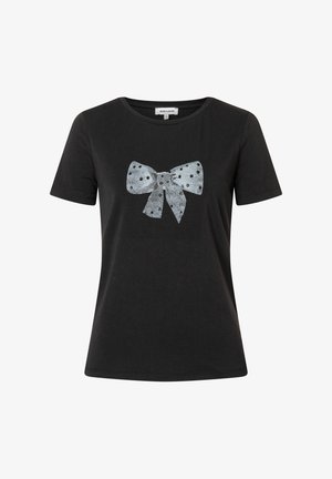 Black short-sleeve t-shirt with a silver sequin bow design featuring polka dots and small embellishments across the bow. Round neckline.