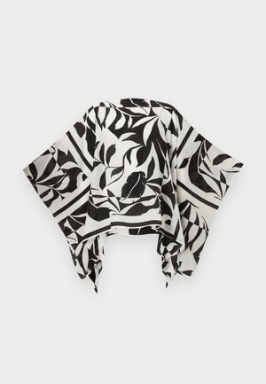 Luźny szal czarno-biały z wzorem liści, z szerokimi końcówkami i nieregularnym obszyciem, rozłożony płasko na jasnym tle.