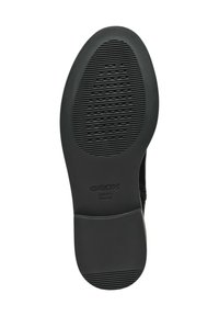 Black rubber outsole with textured grooves and an oval pattern. Features logo embossed on the side and rounded heel for stability.