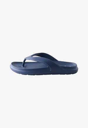 Sandalia tipo flip-flop de goma azul marino con plantilla texturizada y tiras anchas en forma de Y para uso casual.