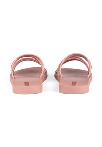 Rosa Gummisandalen mit zwei gewölbten Riemen, strukturiertem Fußbett, flacher Sohle und minimalistischem Design. Stabile und leichte Konstruktion.