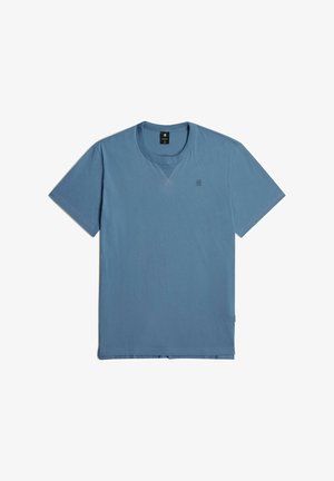 T-shirt in cotone blu con colletto a giro e maniche corte. Logo discreto stampato sul petto. Texture liscia e vestibilità classica.