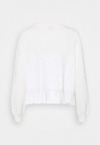 White long-sleeve knit sweater with sequined fringe detail along the lower back hem, displayed against a plain background.
