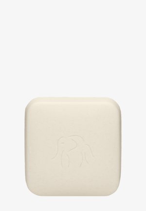 Solid, square soap bar in off-white with a smooth texture; features an embossed elephant design on the surface.