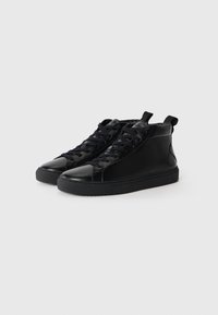 Black high-top sneakers made of smooth leather with a round toe, featuring black laces, a padded collar, and a textured rubber sole.