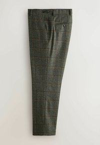 Hose mit einem dunkelgrünen Karomuster, gefertigt aus strukturiertem Stoff. Merkmale sind zwei vordere Taschen, zwei hintere Taschen und Gürtelschlaufen.