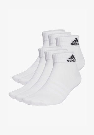 Biele členkové ponožky z bavlneného zmesi. Ramená s prúžkovaným vzorom s čiernym logom Adidas a tromi pruhmi na stranách. Balenie štyroch párov.