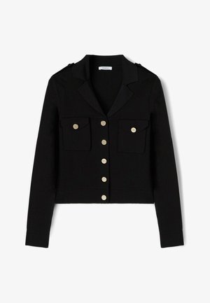 Schwarze langärmelige, gekürzte Jacke mit Reverskragen, sechs goldenen Knöpfen vorn und zwei mit Knöpfen verschlossenen Brusttaschen.