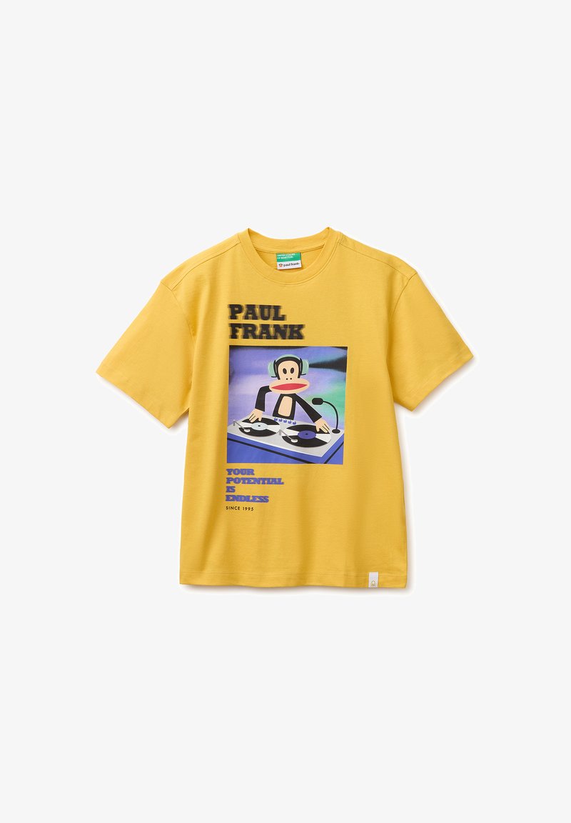 T-shirt jaune à manches courtes avec le texte Paul Frank et un graphique d'un singe de dessin animé DJ avec des écouteurs et des platines.