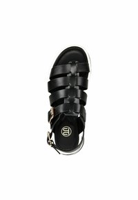 Black leather sandal with multiple strap design, adjustable ankle buckle, and a white sole; features smooth texture and minimalist branding.