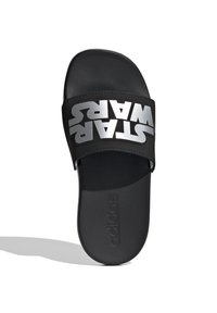Black slide sandal with a wide strap featuring silver "STAR WARS" text. Textured footbed and smooth sole, minimalist design, branded logo visible.