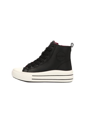 Zapatilla alta negra con suela de plataforma blanca, cordones negros y un parche de logo circular en el costado, mostrada en perfil derecho.