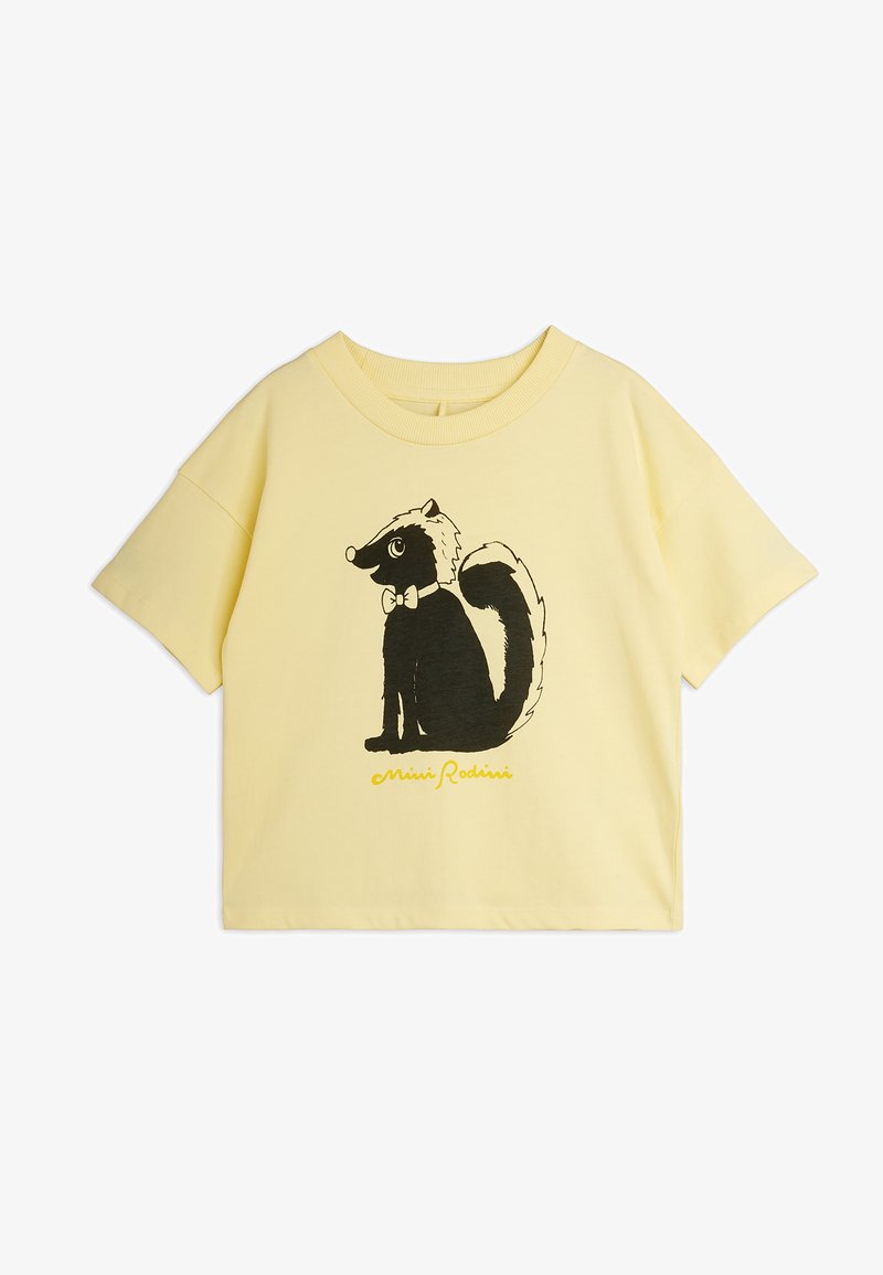 Κίτρινο κοντομάνικο t-shirt με ένα ασπρόμαυρο σκάνκ που φοράει παπιγιόν στο κέντρο μπροστά, με το κείμενο "Mini Rodini" από κάτω.