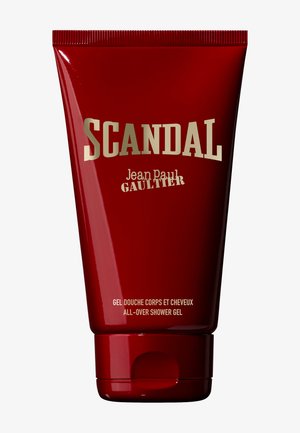 Rotes Fläschchen des Scandal Jean Paul Gaultier Ganzkörper-Duschgels mit goldener und weißer Schrift auf einfachem Hintergrund.