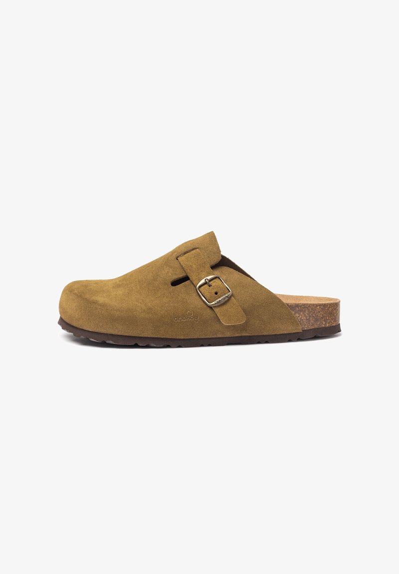 Suede clogs in olive green with a rounded toe, adjustable buckle, and cork footbed. Treaded rubber sole for grip and durability.