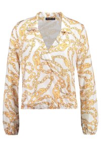 Blouse blanche à motifs de chaînes dorées. Manches longues avec des poignets élastiques et une taille cintrée. Fabriquée en tissu lisse et léger.