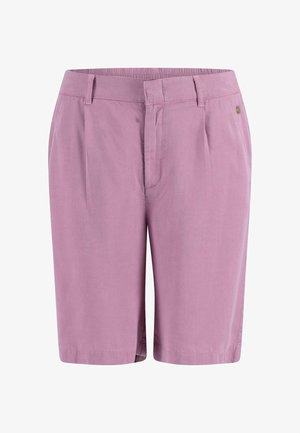 Világoslila sort, sima szövettextúrával, redős elülső résszel, övhurkokkal és egyetlen fémszegéllyel a derékrészen.