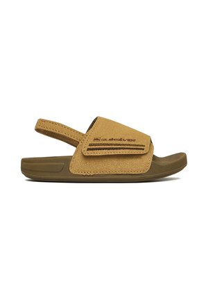 Brun åben tå-sandal med justerbar velcrolukning over foden og en elastisk hælstrop, med Quiksilver-logoet på siden.