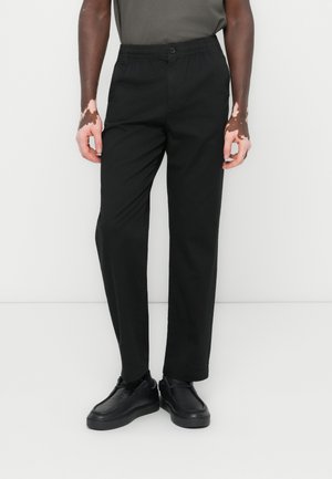Black elastic waist trousers made of lightweight fabric, featuring a straight cut, subtle sheen, and a button closure at the front.