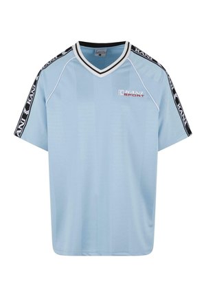 Light blue short-sleeve sports shirt with a V-neck, black and white accents on sleeves, and "KANI SPORT" logo in red. Smooth fabric texture.
