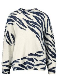 Pull en laine crème avec motif rayures tigre bleu marine, doté d'une coupe décontractée et d'un col rond. Texture douce et manches larges.