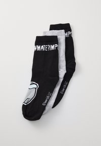 Three pairs of socks: one black with a cartoon character design, one gray, and one black with white text at the top. Cotton blend material.