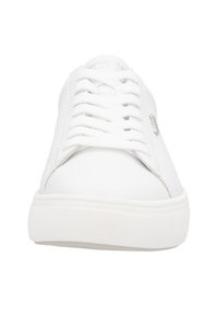 White sneaker with a smooth leather upper, rounded toe, flat laces, and a textured rubber sole. Features a small metallic logo on the side.