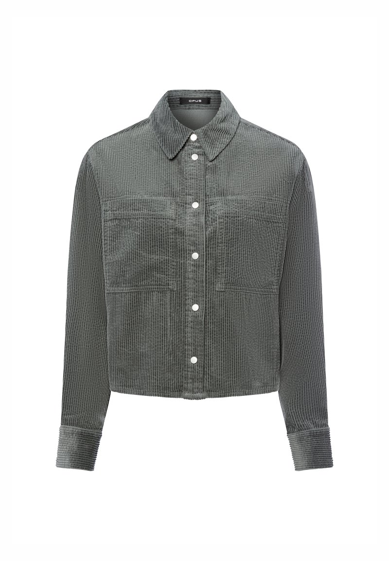 Giacca in corduroy grigia con colletto, maniche lunghe, chiusura a bottoni e due tasche frontali; presenta una texture a coste e accessori a bottoni in contrasto.