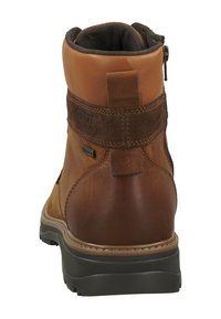 Braunes Leder-Ankelboot mit Wildlederakzent und gepolsterter Lasche. Verfügt über einen seitlichen Reißverschluss und eine strukturierte Gummisohle für guten Halt.