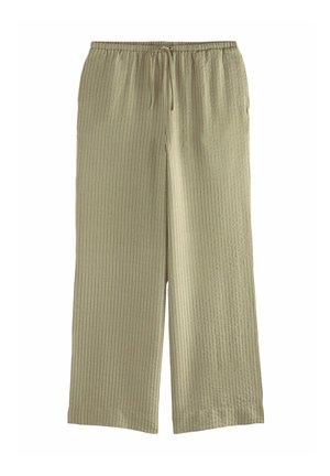 Pantalons en coton ribbé vert clair avec une taille élastique et un cordon de serrage. Couleur ample avec une coupe large.