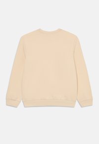 Sweatshirt beige à manches longues, avec un col rond, des poignets et une taille côtelés. Texture lisse, design minimaliste, sans embellissements visibles.