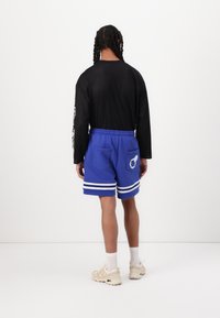 Pal Sporting Goods WET PASS UNISEX - Spodnji deli trenirk - bluig