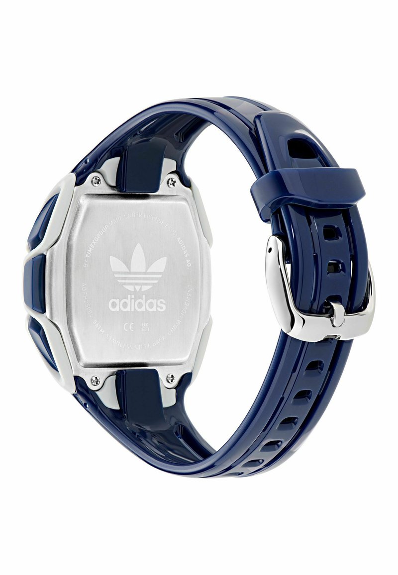 Orologio blu navy con cinturino in silicone, retro in acciaio inossidabile argento e dettagli bianchi vicino al quadrante, con un dettaglio logo sul retro.