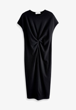 Musta lyhythihainen mekko pehmeästä kankaasta. Edessä on kierretty yksityiskohta, joka luo laskostetun vaikutelman. Yksinkertainen, rento siluetti.