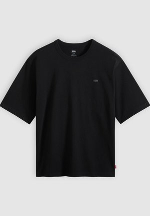 Μαύρο βαμβακερό T-shirt με στρογγυλή λαιμόκοψη και κοντά μανίκια. Περιλαμβάνει μικρό λογότυπο στο αριστερό μέρος του στήθους.