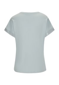 Light blue short-sleeve T-shirt made from soft fabric, featuring a round neckline and mesh accents on the sleeves.