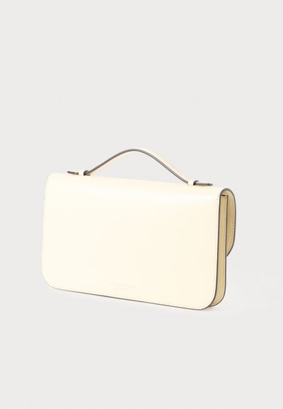 Cream leather rectangular handbag with top handle and subtle Victoria Beckham embossed logo on front flap.