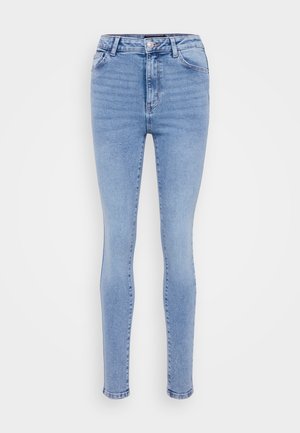 Lyseblå høytlivde skinnyjeans laget av denim. Har fem lommer, beltehemper og knappelukking. Smooth tekstur med minimal falming.