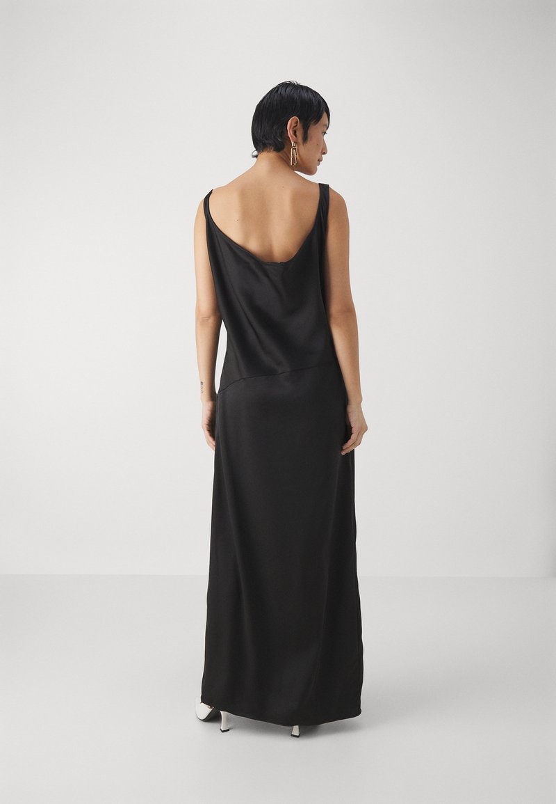 formal black and silver dresses Spectacular Spring 1973 Halston Runway Side Cut Out Black Jersey Bias Cut  Dress w Open Back