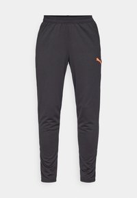 Schwarze Sporthosen aus leichtem Stoff mit schmal zulaufendem Design. Verfügt über einen elastischen Bund und ein oranges Puma-Logo auf dem linken Oberschenkel.